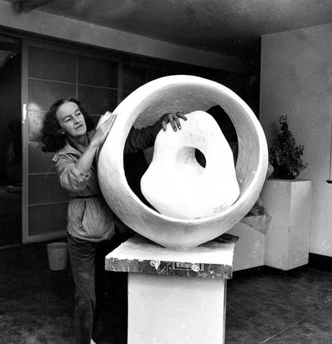 Photograph of Barbara Hepworth with her sculpture in her St Ives studio, 1963