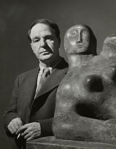 Photograph of Henry Moor next to his sculpture, Museum of Modern Art, New York, 1946