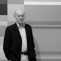 Photograph of John Eaves alongside his work